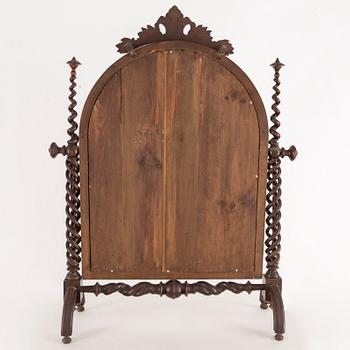 A late 19th century oak mirror.