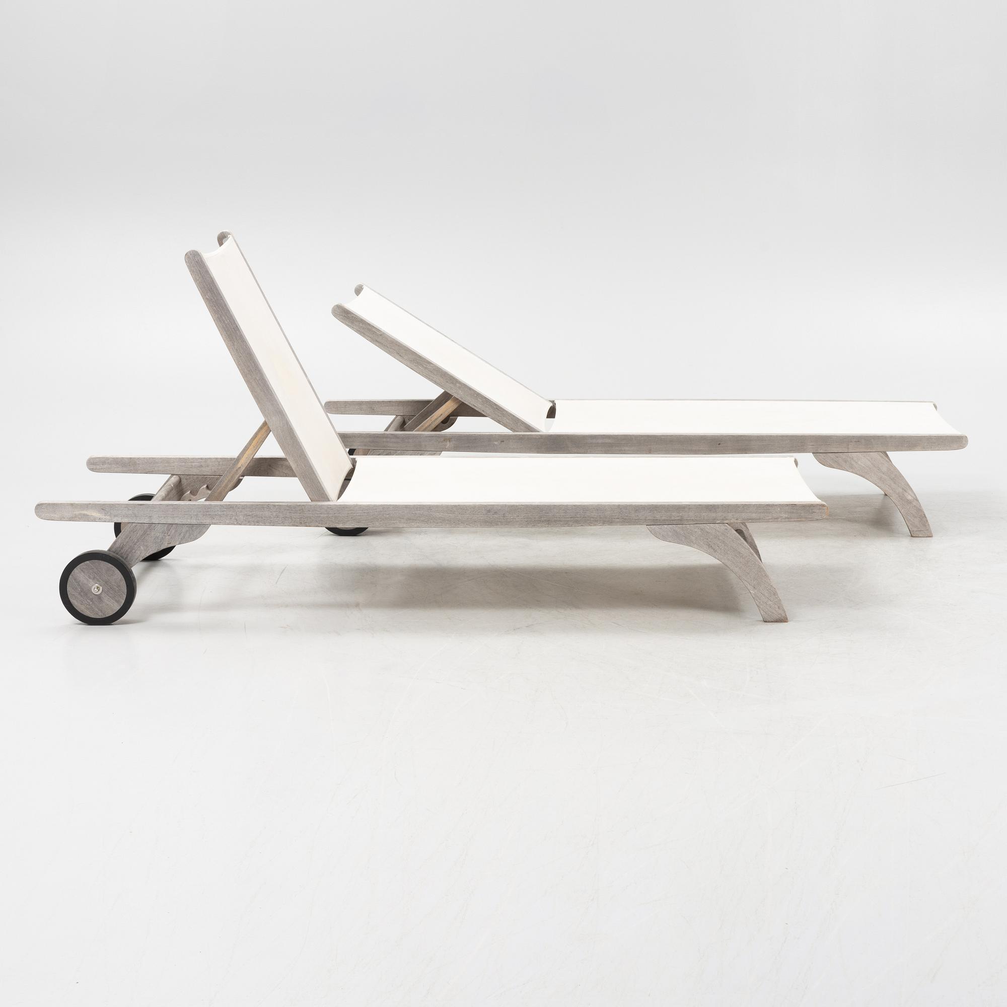 A pair of 'Columbus Sunbed' teak deck chairs, Skagerak, Denmark.