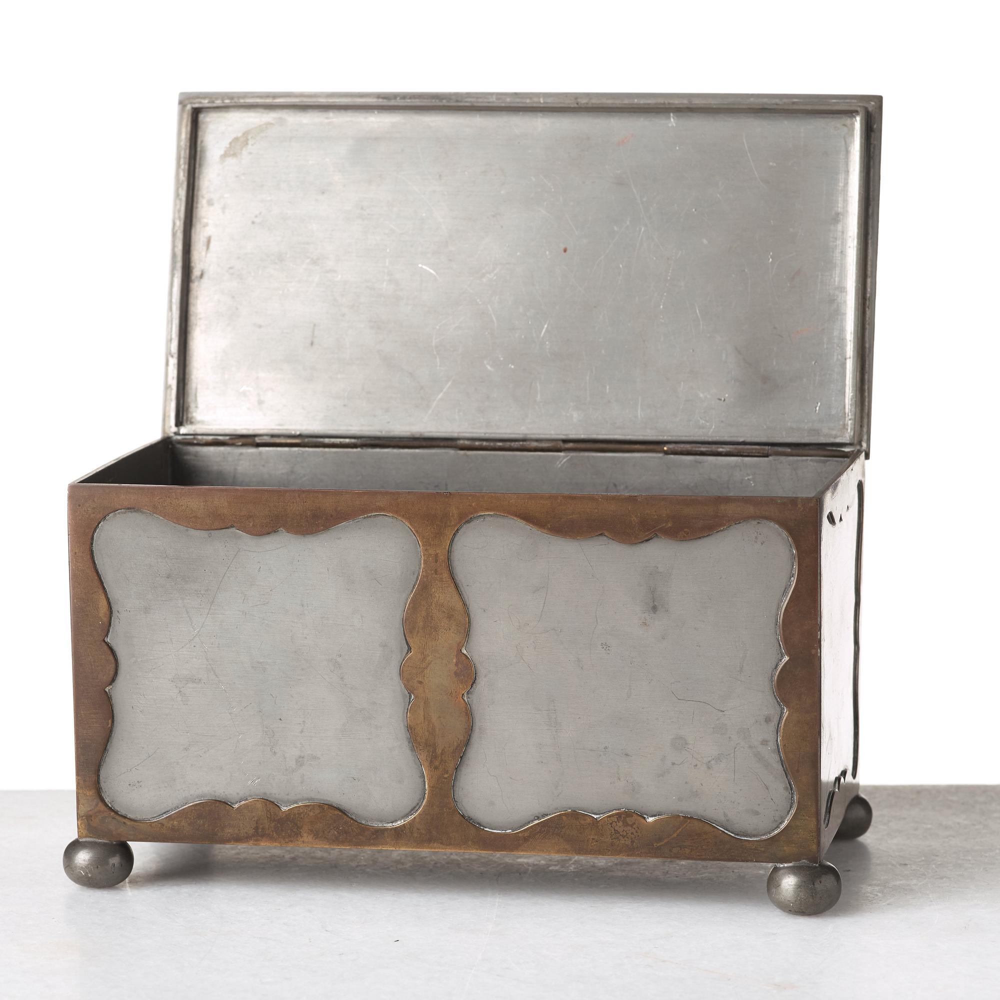 Firma Svenskt Tenn, a pewter and brass box, Stockholm 1930, model A 854.