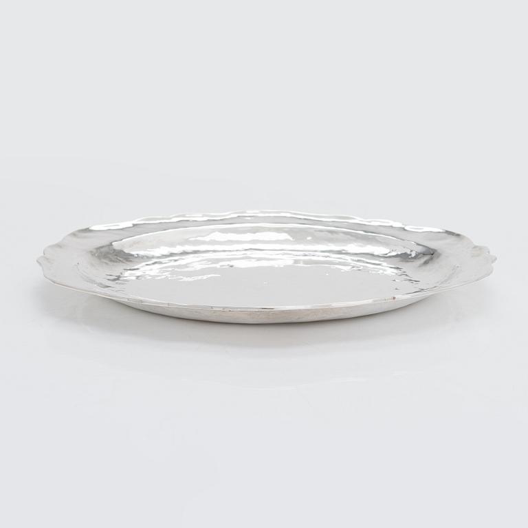 A 12-piece set of sterling silver chargers, Peru 1950s-60s.