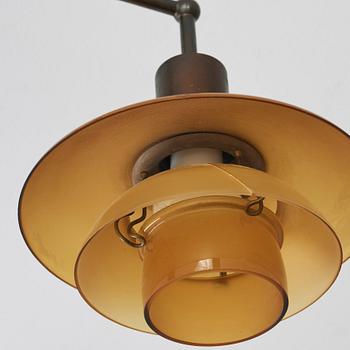 Poul Henningsen, a 'PH-2/2' wall lamp with amber coloured glass shades, Louis Poulsen, Denmark 1930's.