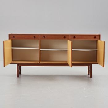A late 20th Century teak veneered sideboard.