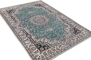 A Nain carpet, part silk, 6 laa, ca. 300 x 201 cm.