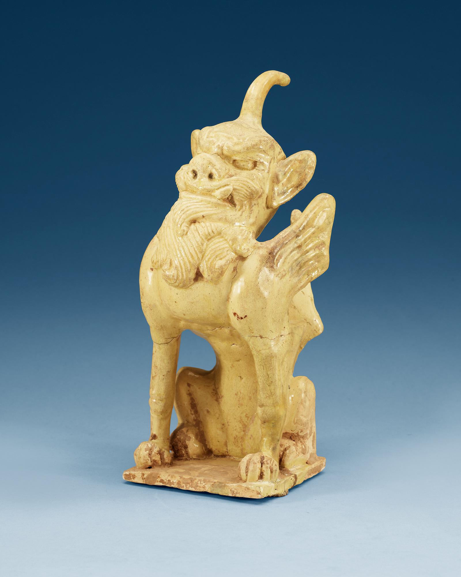 A yellow glazed pottery guardian, Tang dynasty (618-907).