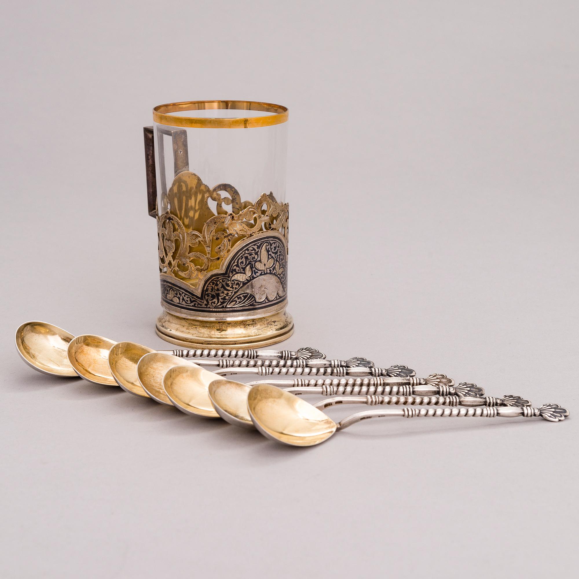 A Russian silver teaglass holder and seven teaspoons, Moscow and Kiev, first half and mid-20th Century.