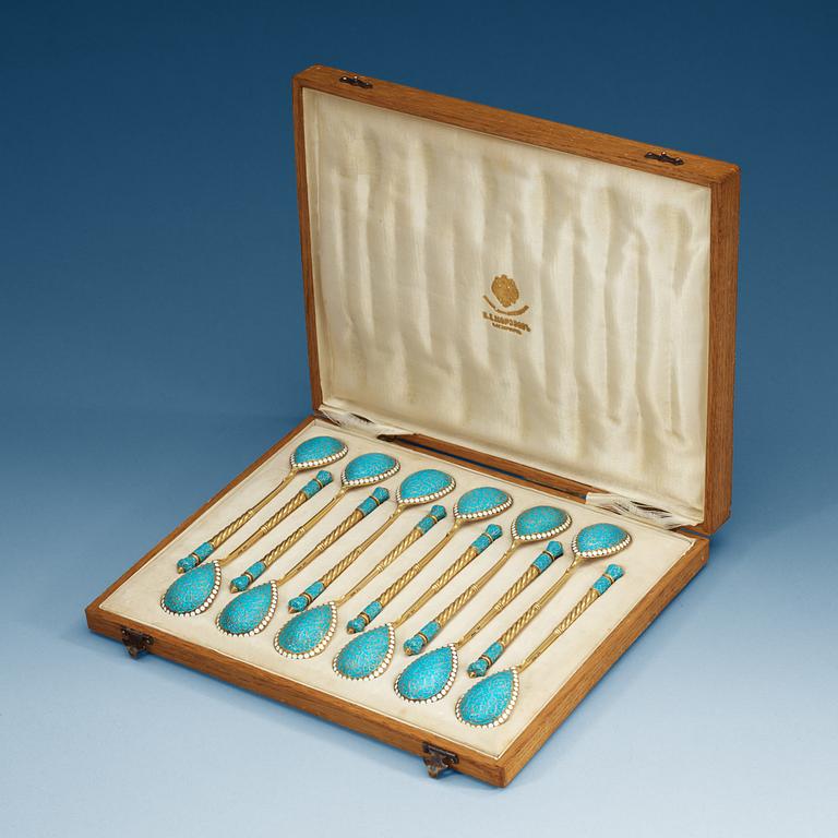 A Russian set of 12 silver-gilt and enamel tea-spoons, makers mark of Gustav Klingert, Moscow 1899-1908.