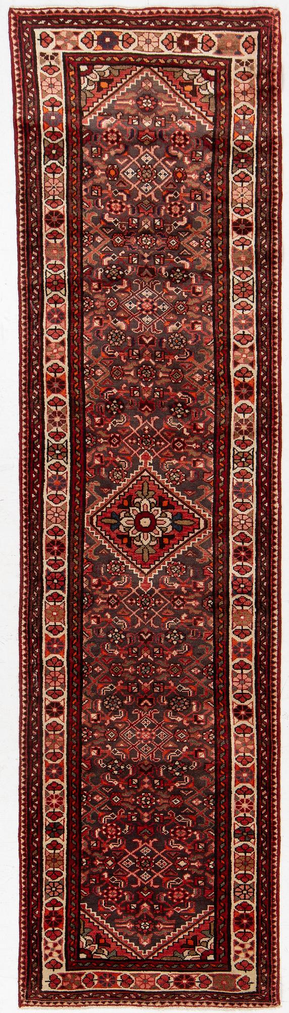 A runner  carpet, Hamadan, 305 x 80 cm.