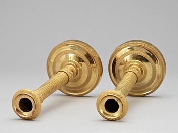 A pair of French Empire early 19th Century candlesticks.