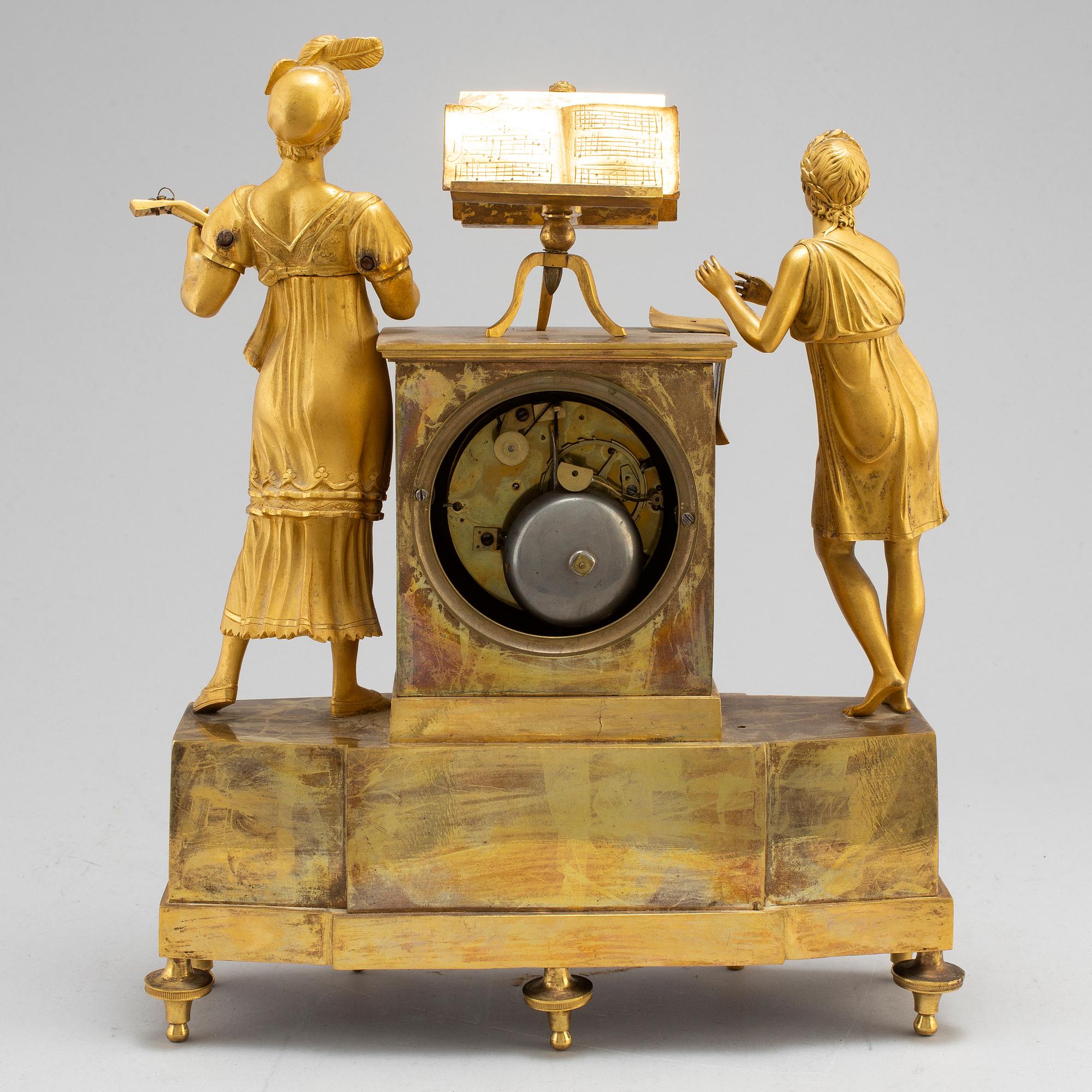 A French Empire gilt bronze mantel clock, first half of the 19th century.