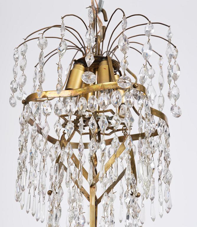 A late-Gustavian five-light gilt brass and cut glass chandelier, Stockholm, circa 1800.