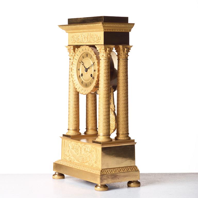 A Empire early 19th century gilt bronze mantel clock.