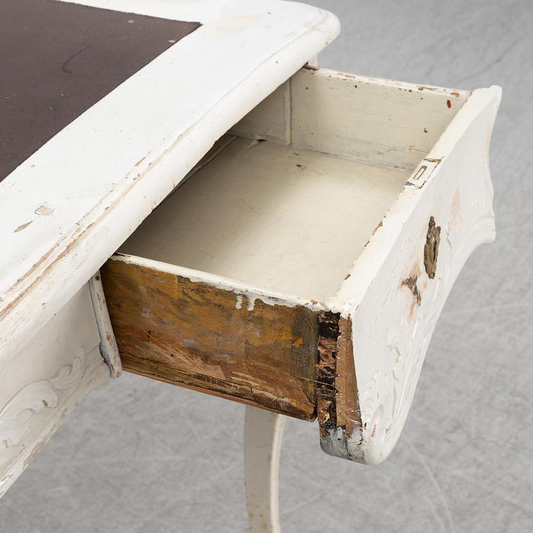A painted rococo writing desk, mid 18th Century with later parts.
