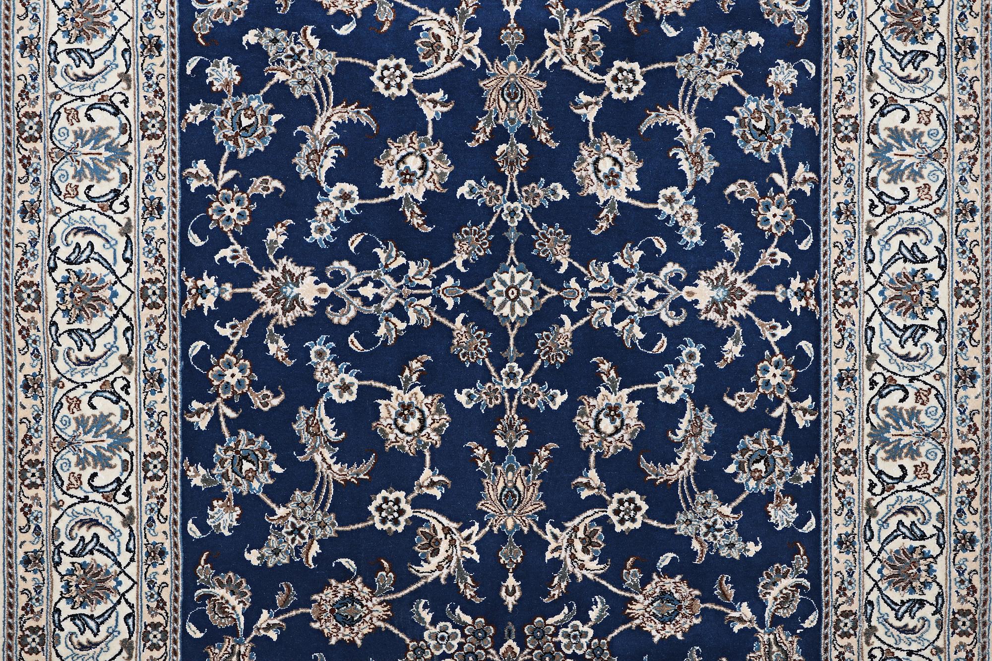 A carpet, Nain, part silk, ca 297 x 194 cm.