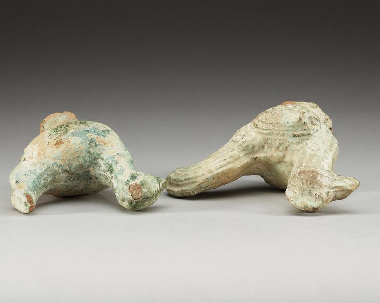 A set of two green glazed pottery models of a rooster and a hen, Han dynasty (206 BC- 220 AD).