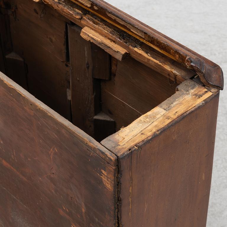 A long-case clock, England, 19th century.