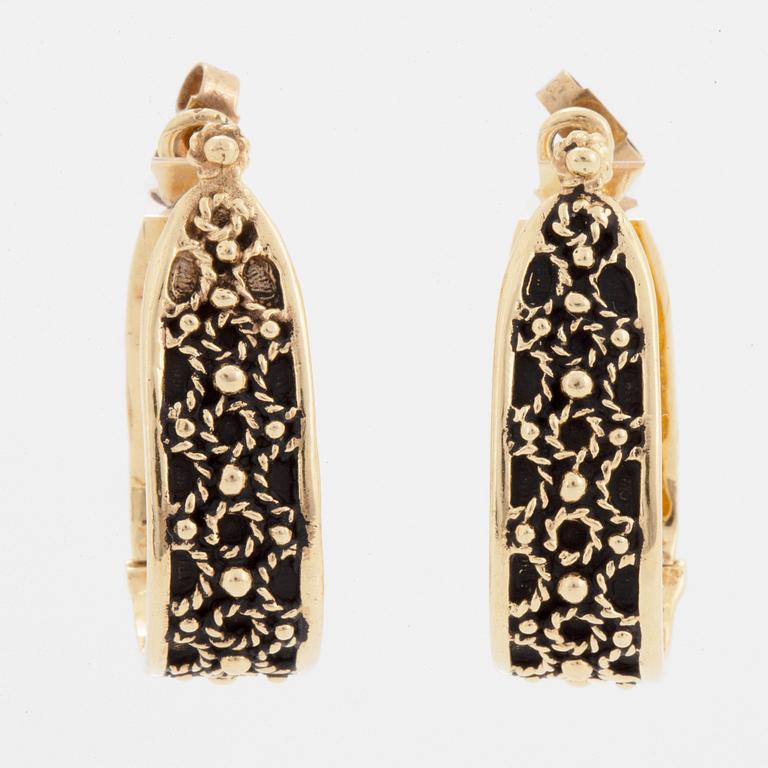 14K gold hoop earrings.