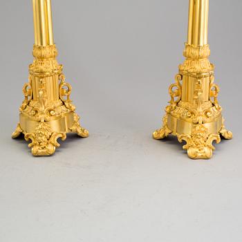 A pair of mid 19th century Empire gilt bronze candelabras.