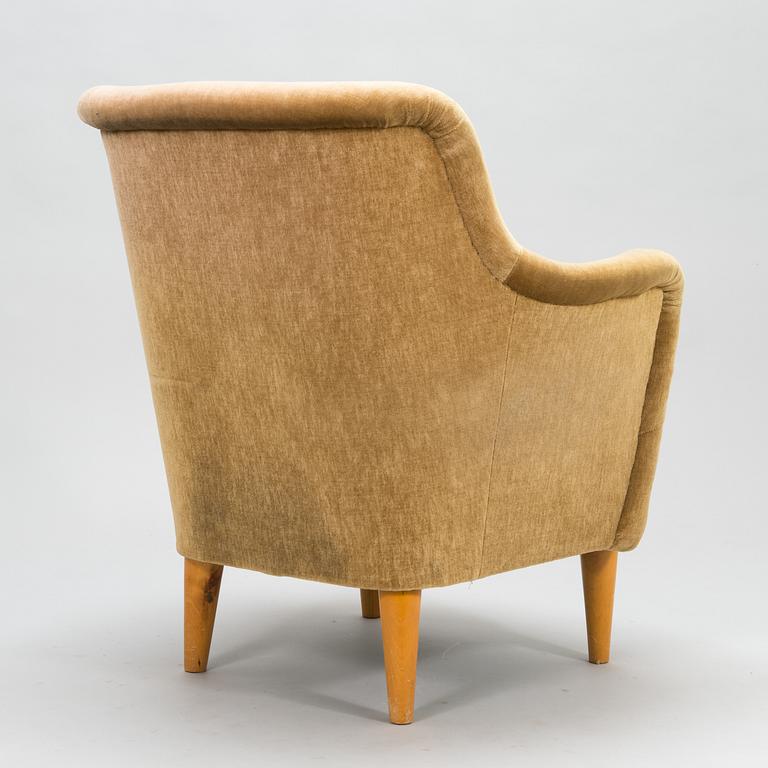 A mid-20th-century sofa and armchair.