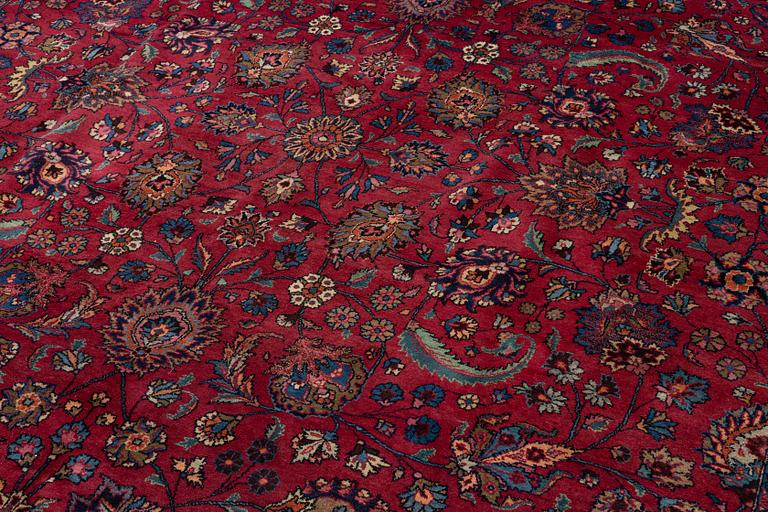 A semi-antique Mashad carpet of Shah Abbas design, c 516 x 360 cm.