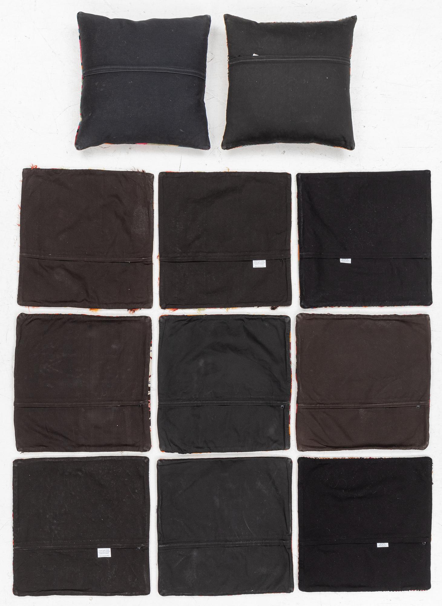 Nine Kilim pillow cases and two Kilim pillows, around 1970, ca. 50 x 50 cm.