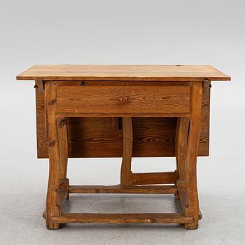 A 18th century gate-leg table.