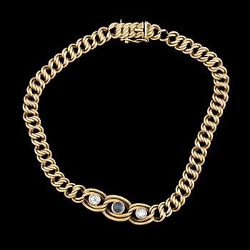 ARMBAND,18k guld med diamanter, tot ca 0,2 ct och safir. Vikt ca 13,5 gram.
