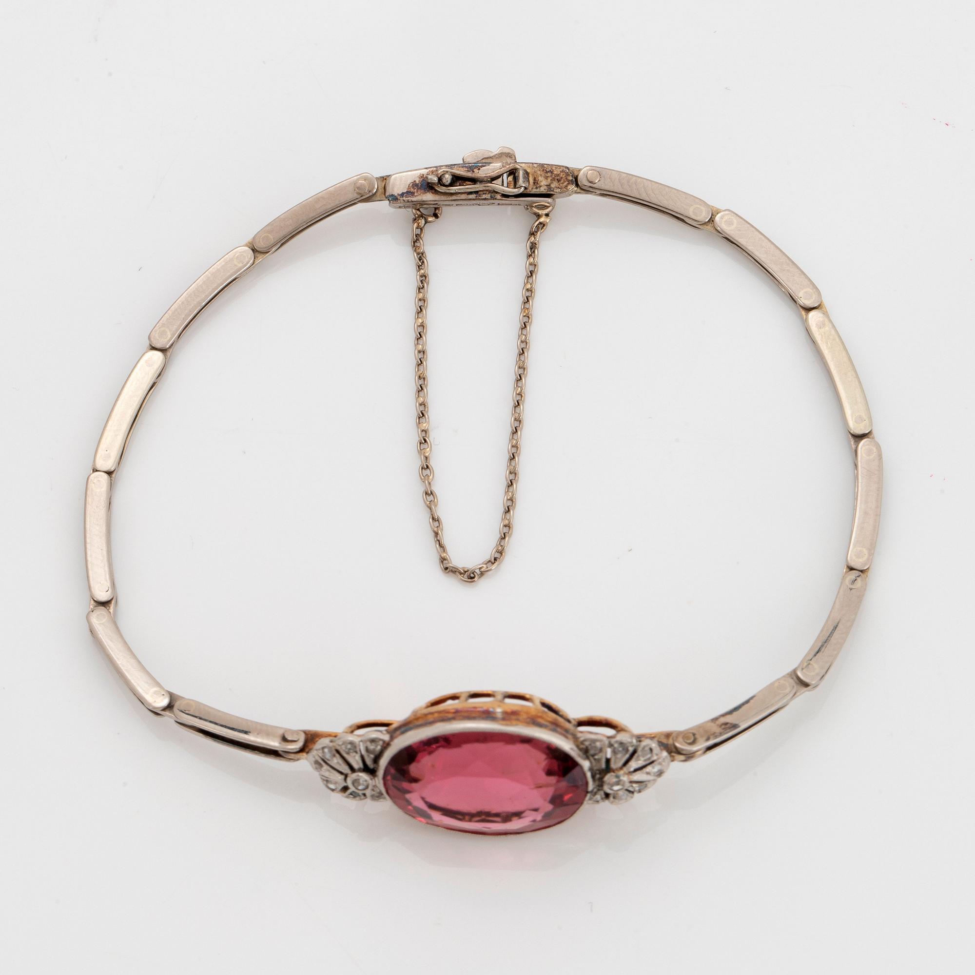 An 18K gold bracelet set with a faceted pink tourmaline weight ca 6.00 cts.