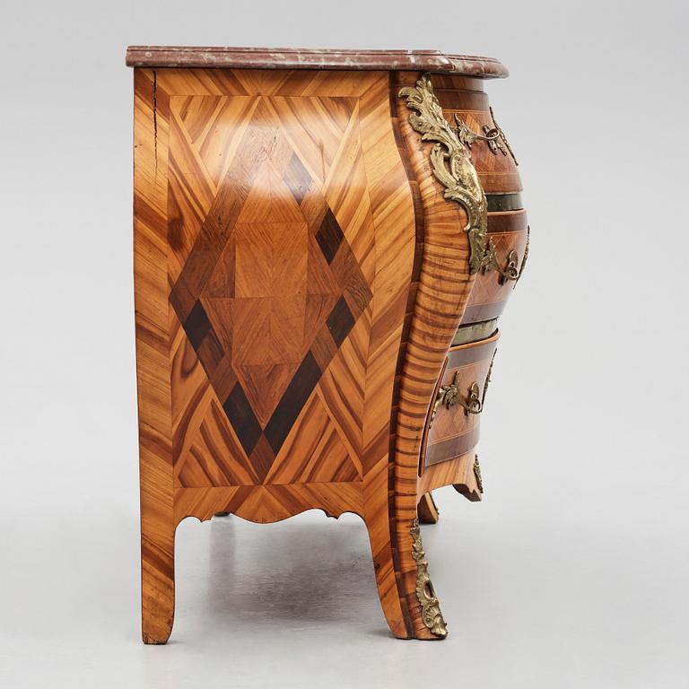 A Swedish Rococo commode, veneered with rosewood and amaranth.