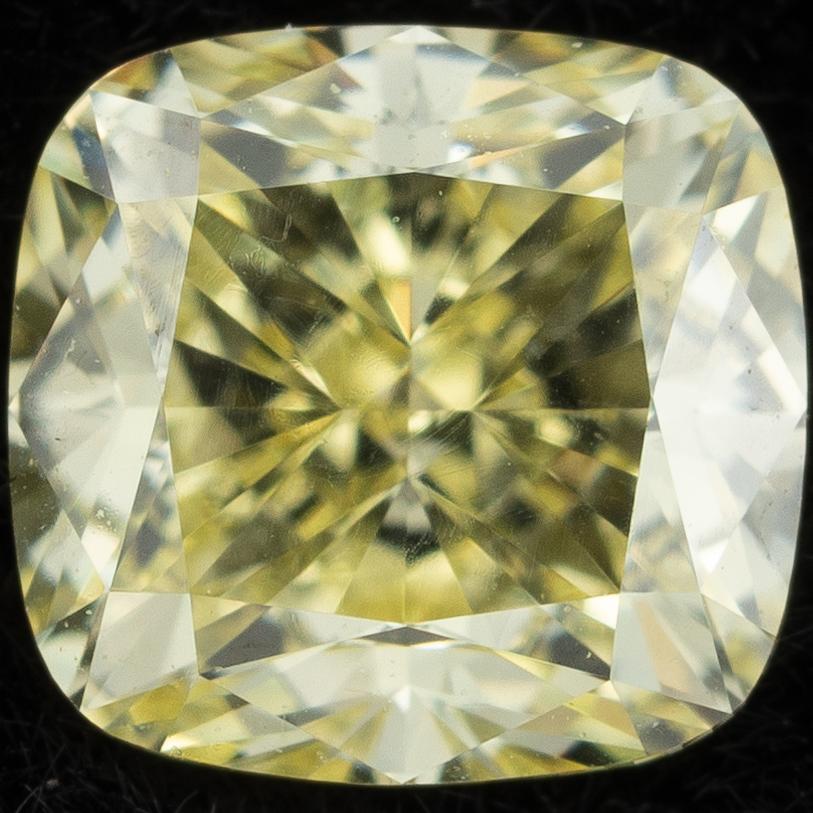 Cushion-shaped yellow diamond, 0.58 ct, accompanied by GIA report.