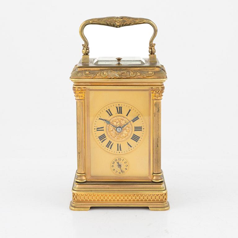 A French Brass and Glass Aiguilles Carriage Clock with Leather Case, first half of the 20th century.