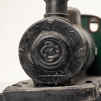 Model train with track and station building, 13 pieces, Germany, 1920s.