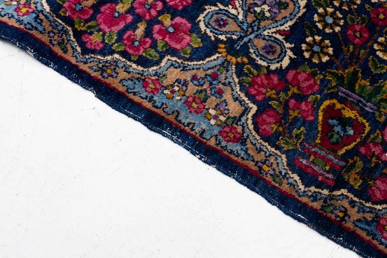 A semi-antique Kirman carpet, south Persia, c. 440 x 279 cm.