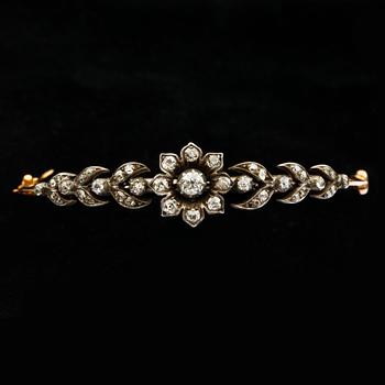 ARMRING, 14k guld och silver med antikslipade diamanter, tot ca0,90ct. Tidigt 1900-tal. Vikt 11,8g.