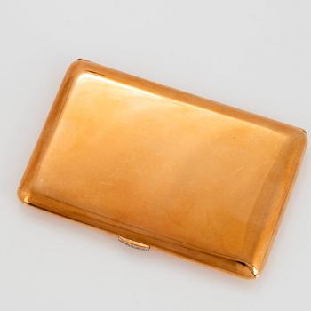 A WA Bolin cigarette case in 14K gold set with eight-cut diamonds.