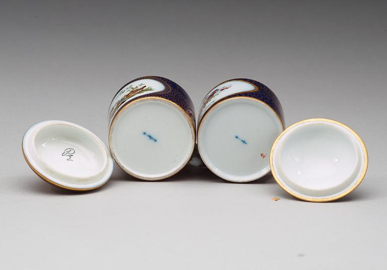 Two Berlin cups with covers and stands, circa 1800.