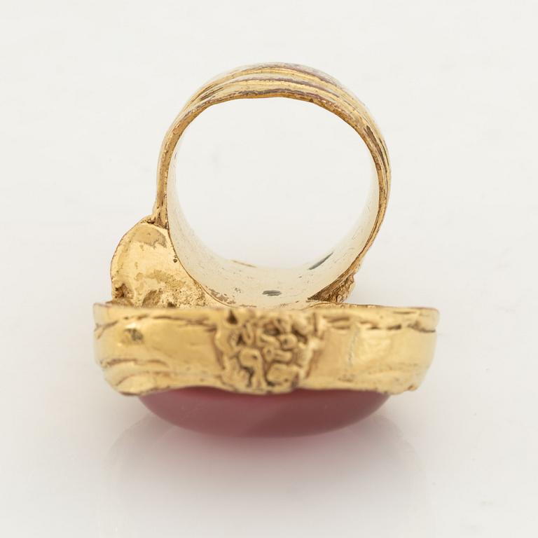 An Yves Saint Laurent ring.