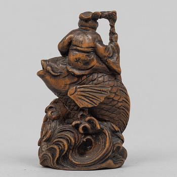 A Japanese carved wooden netsuke, Meiji (1868-1912). Signed.