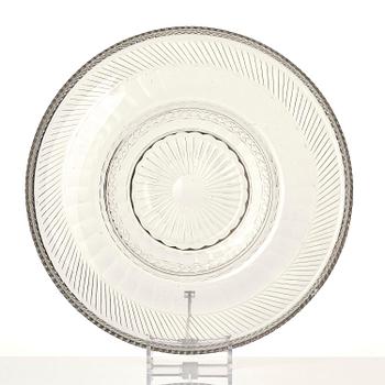 A cut glass punch bowl with cover, stand and ladle, Empire, first part of the 19th century.