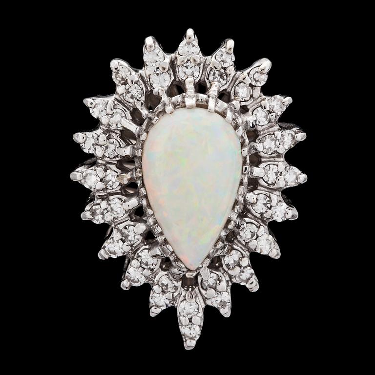 RING, droppformad opal med åttkantslipade diamanter, tot. ca 0.50 ct.
