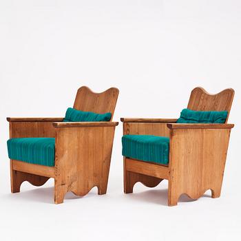 Axel Einar Hjorth, a pair of "Utö" stained pine armchairs, Nordiska Kompaniet 1930s.