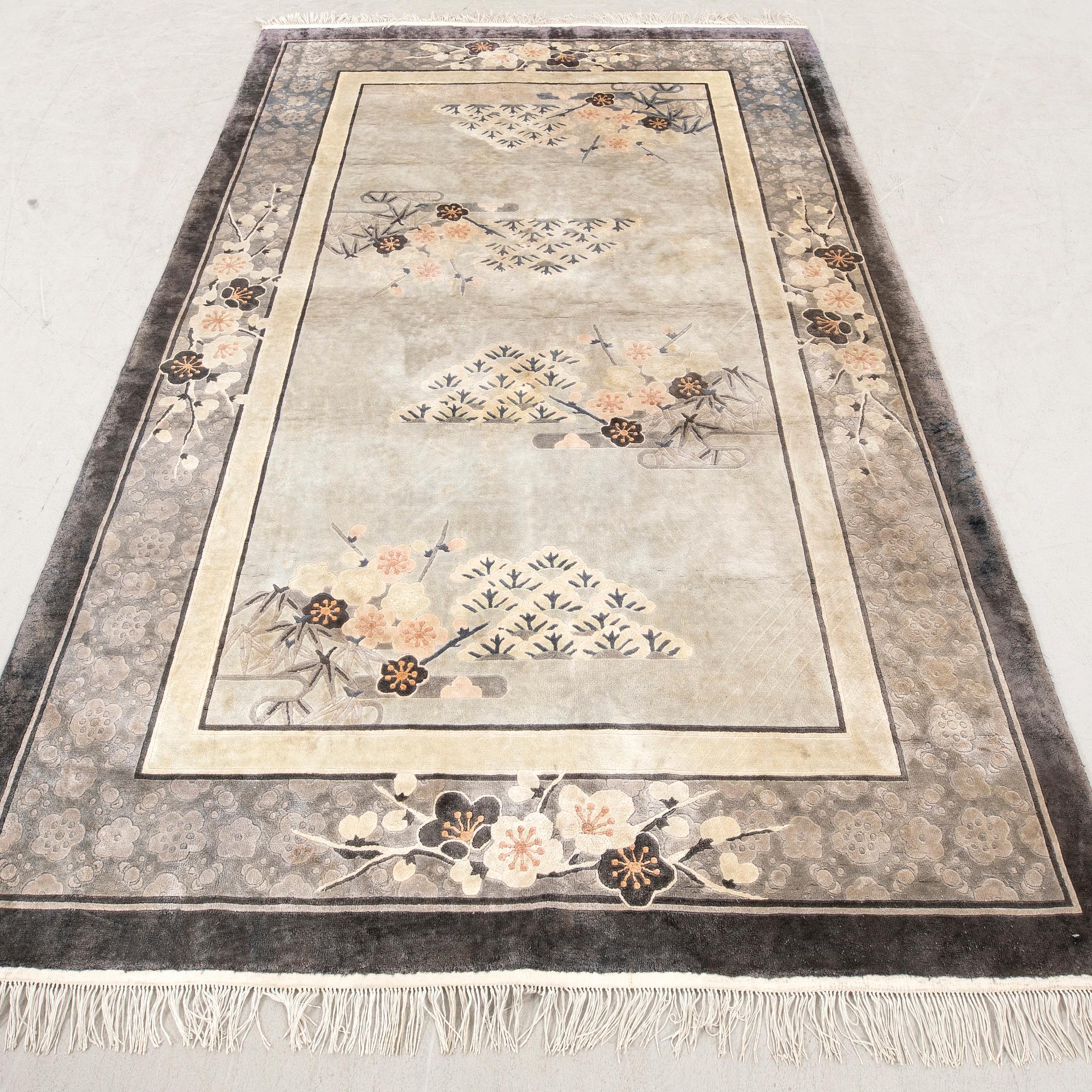 A Chinese old silk carpet ca 240x153 cm.
