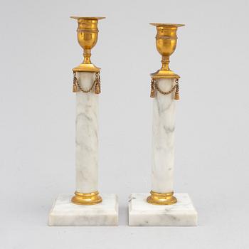 A pair of Gustavians style marble candlesticks, early 20th Century.