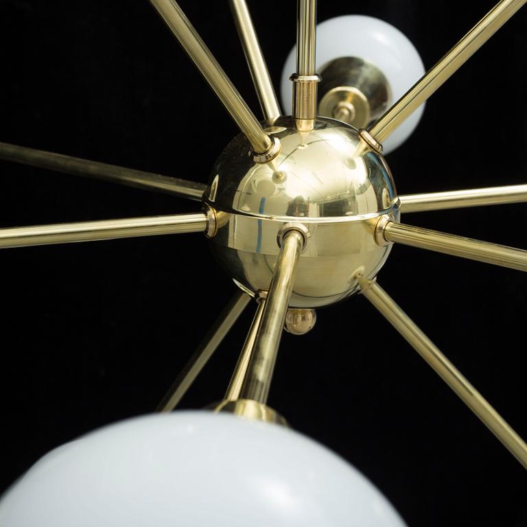 A 20th century "Sputnik model" brass ceiling light. Total height ca 108 cm.