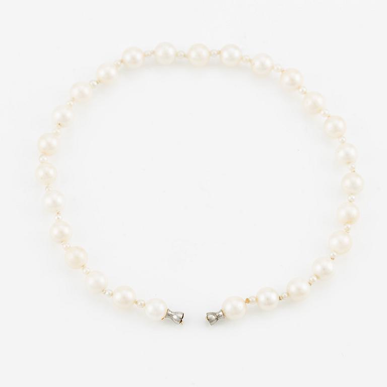 Ole Lynggard lås i form av snäcka 18K vitguld med en rund briljantslipad diamant.