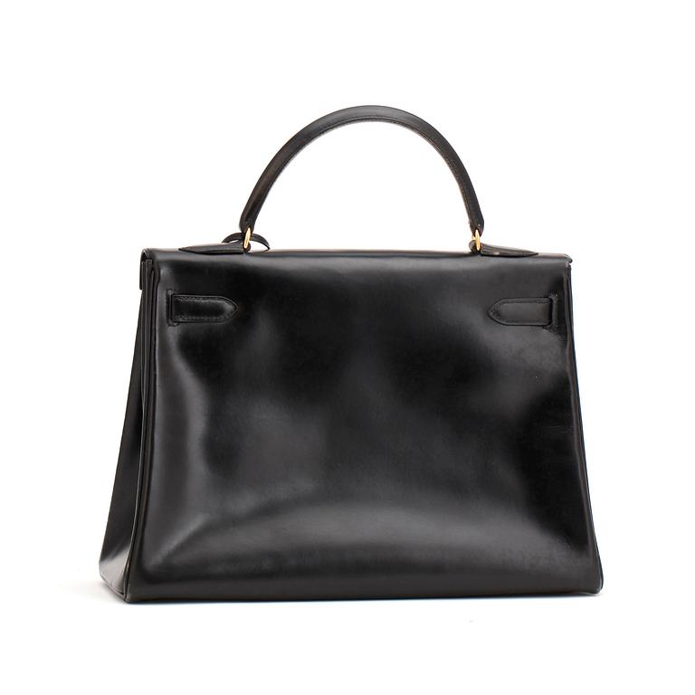 HERMÈS, a black leather bag, "Kelly 32".