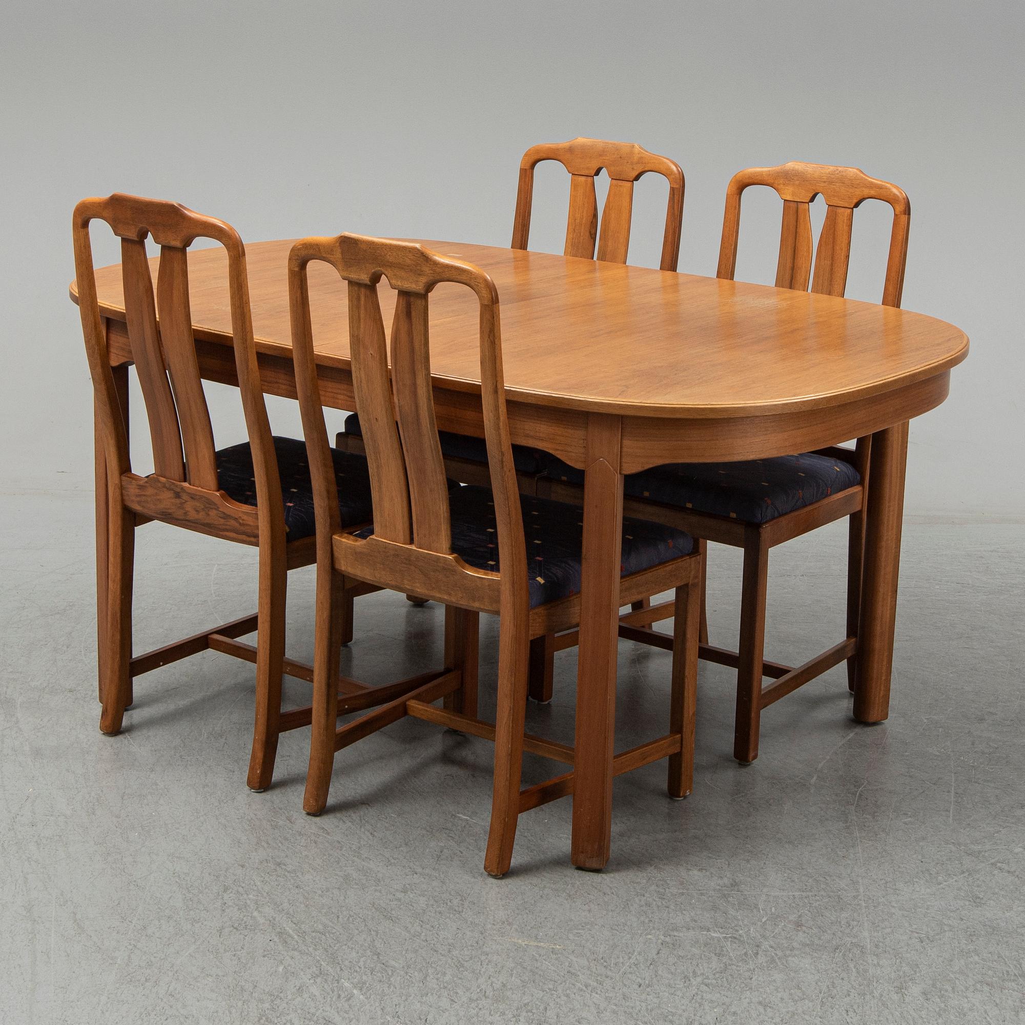 A five-piece walnut 'Ambassadör' dining suite by Carl Malmsten.