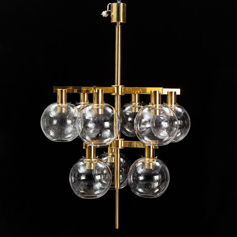 A brass chandelier with glass globes by Hans Agne Jakobsson, Markaryd.