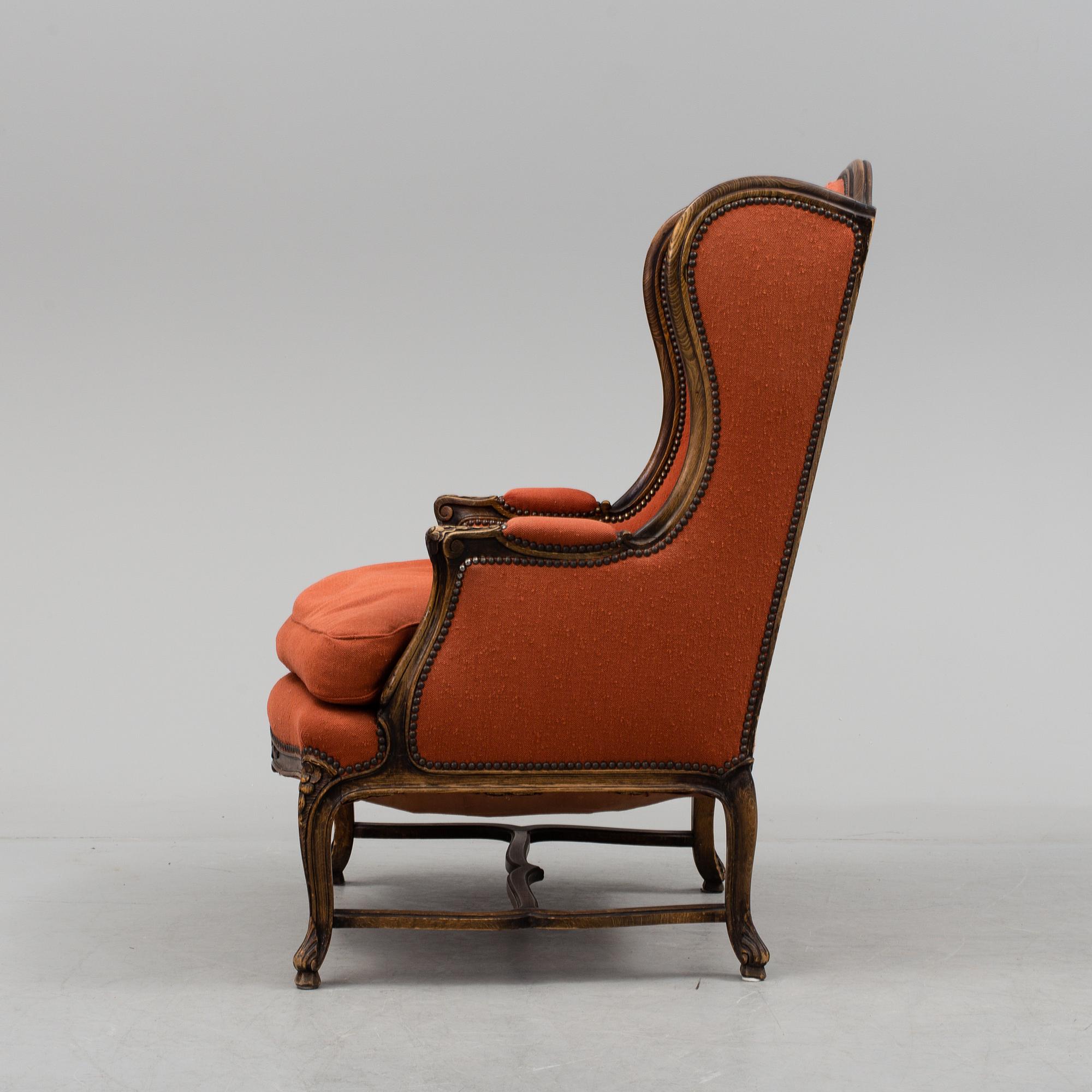 A Louis XV-style armchair, about 1900.