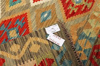 An Afghan Kilim carpet, c. 305 x 200 cm.