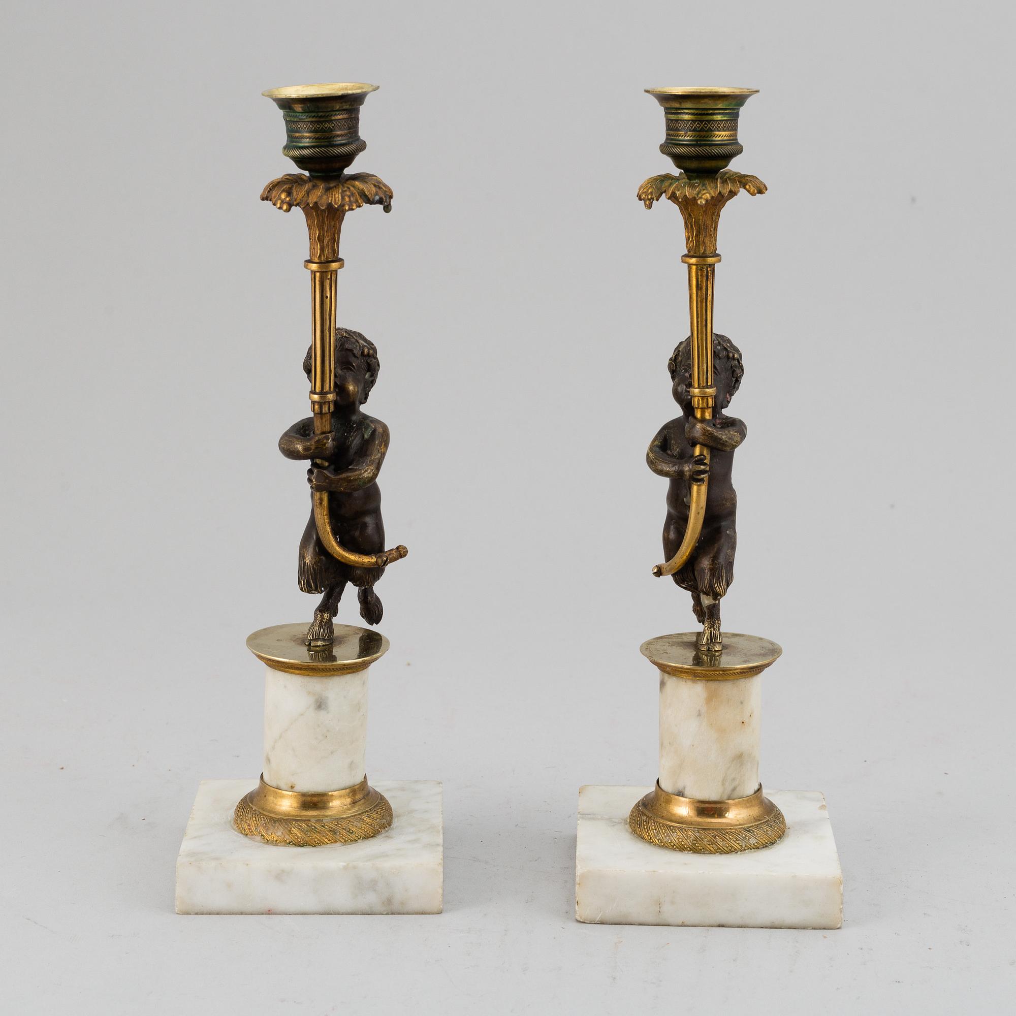 A pair of gustavian style candles sticks, circa 1900.